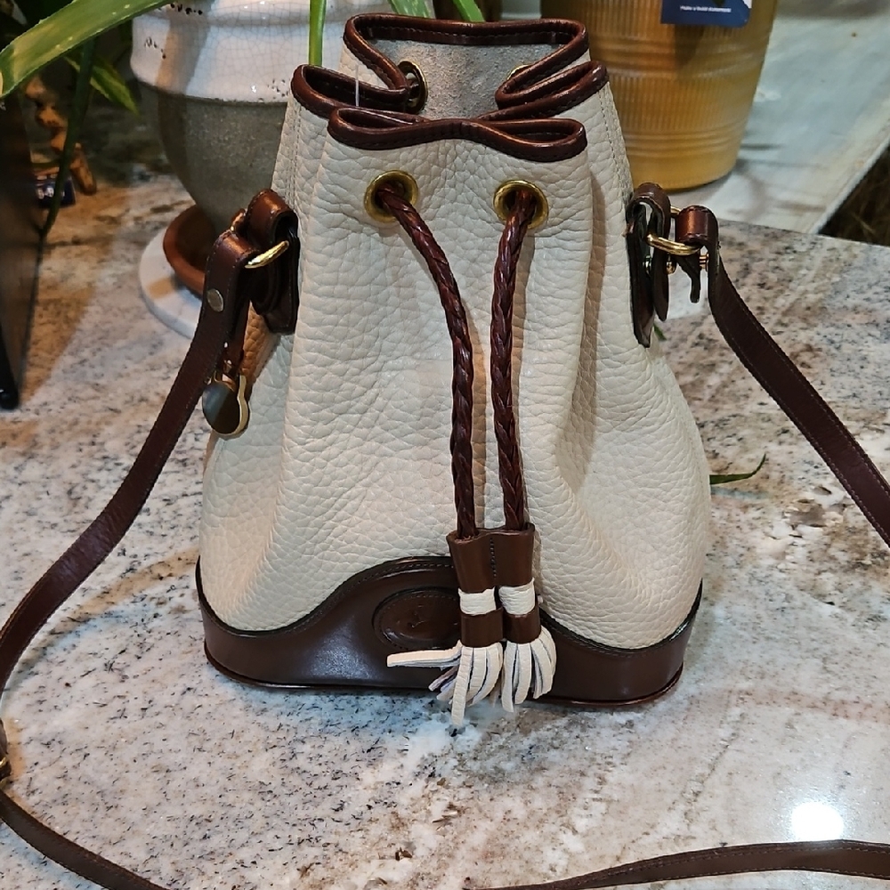 Dooney & Bourke Elegant Cream and Brown Leather Bucket Bag